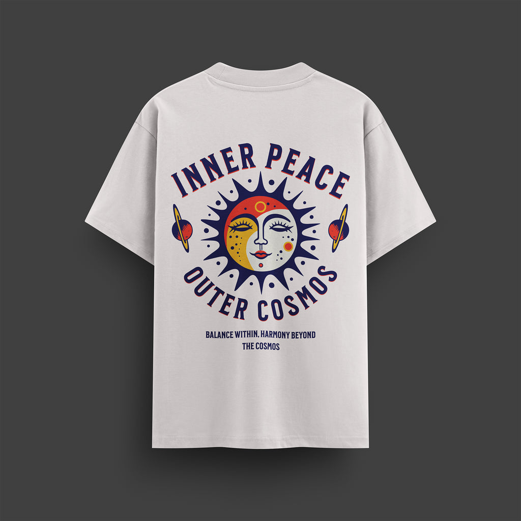White t-shirt with 'Inner Peace Outer Cosmos' design on a dark gray background