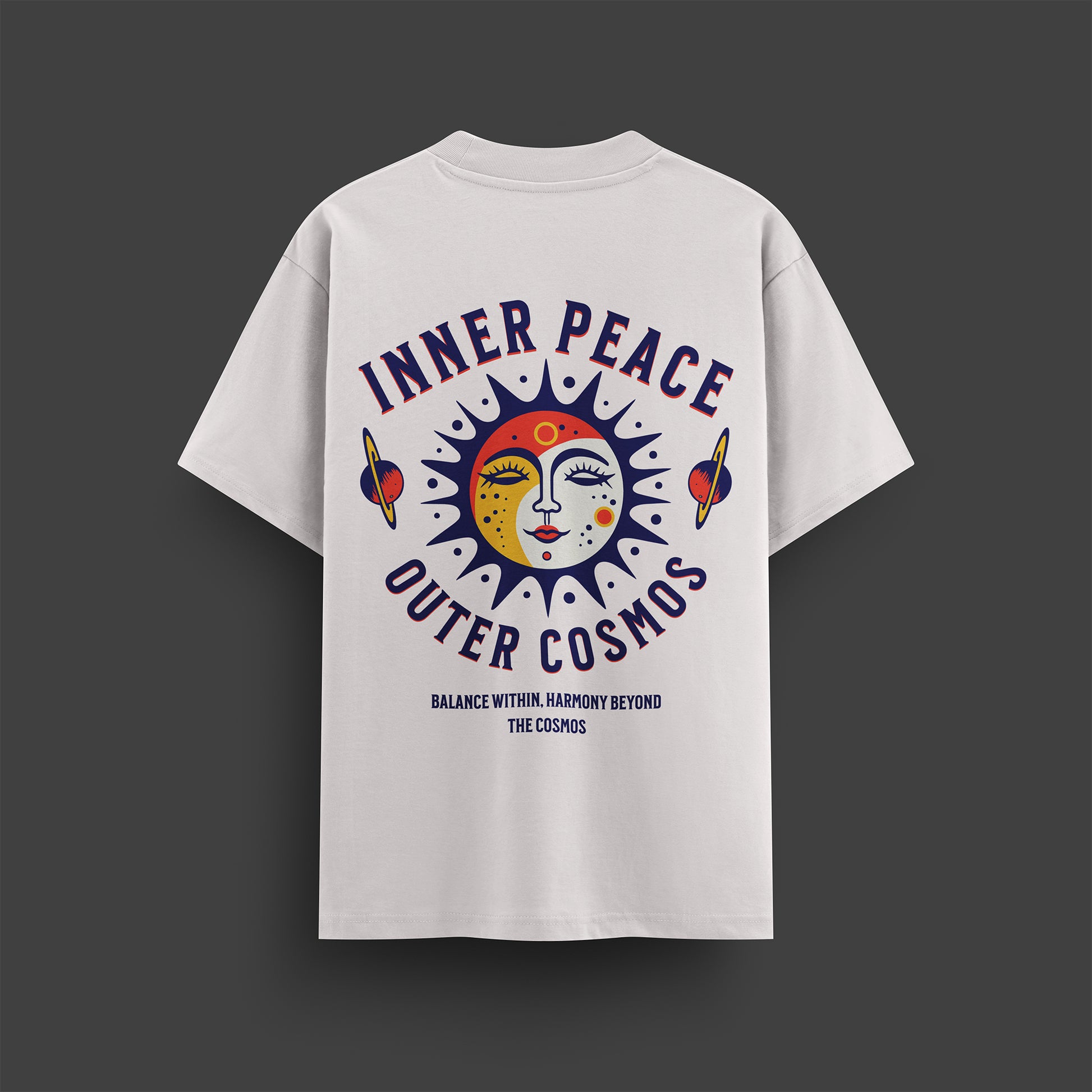 White t-shirt with 'Inner Peace Outer Cosmos' design on a dark gray background