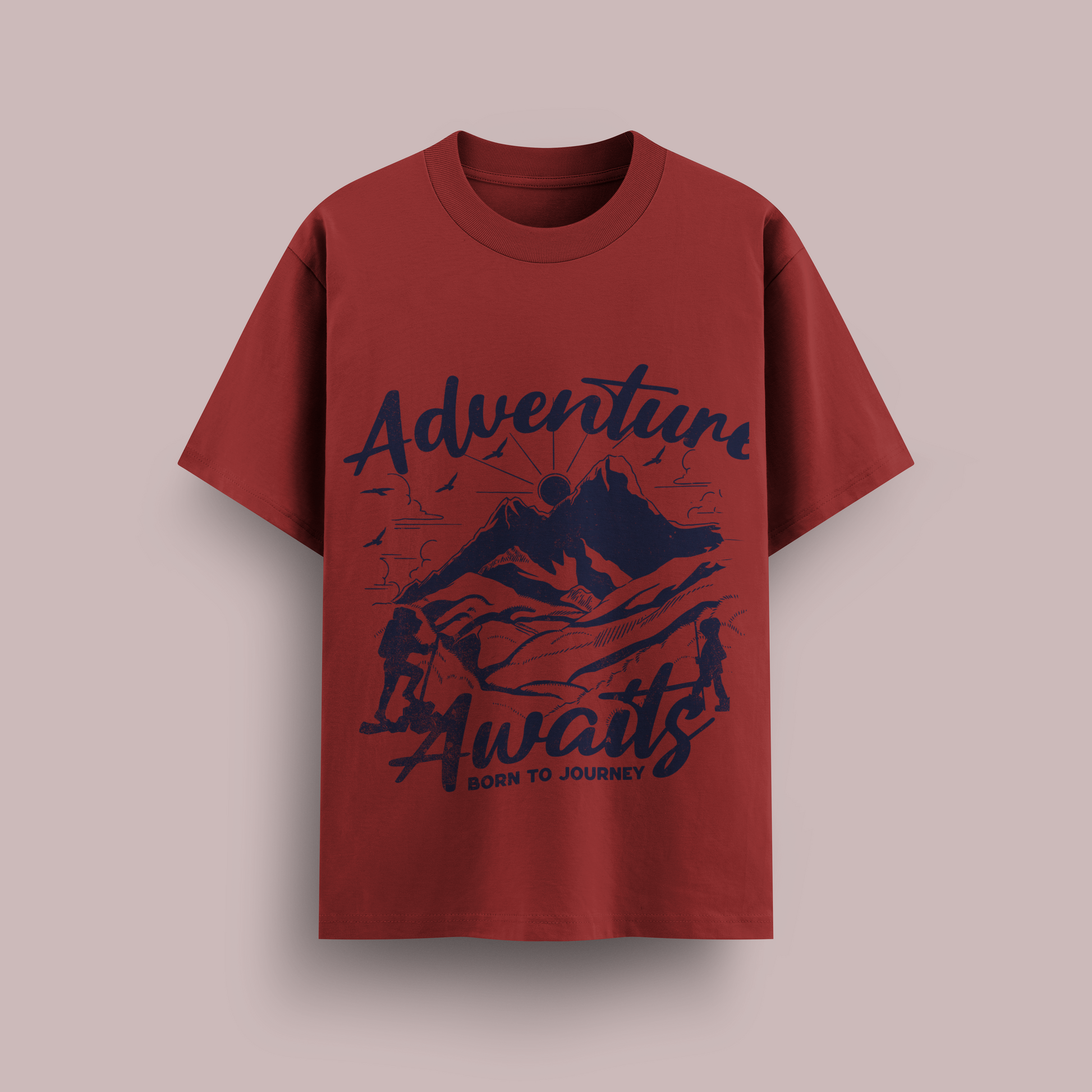 Red t-shirt with 'Adventure Awaits' graphic design on a beige background