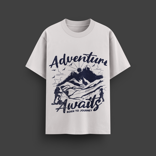 White t-shirt with 'Adventure Awaits' graphic design on a dark background