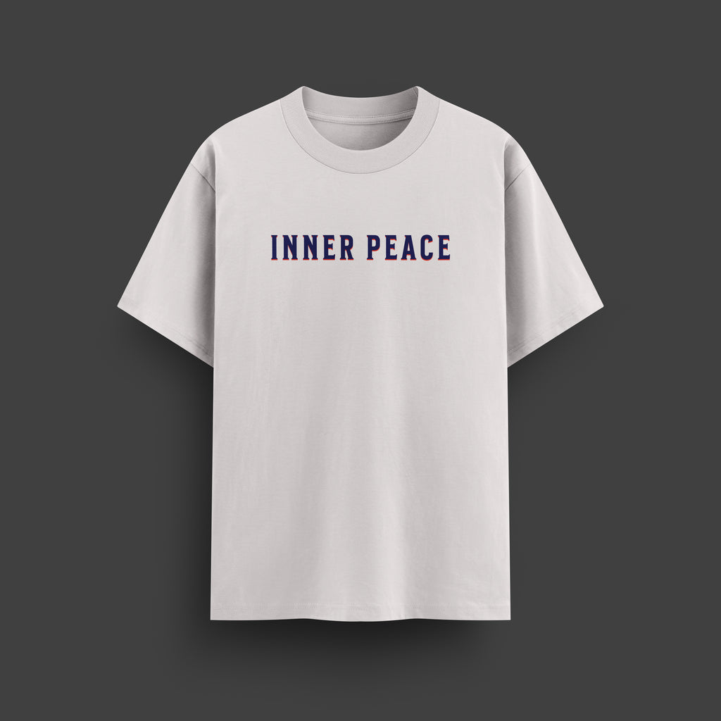 White t-shirt with 'INNER PEACE' text on a dark gray background