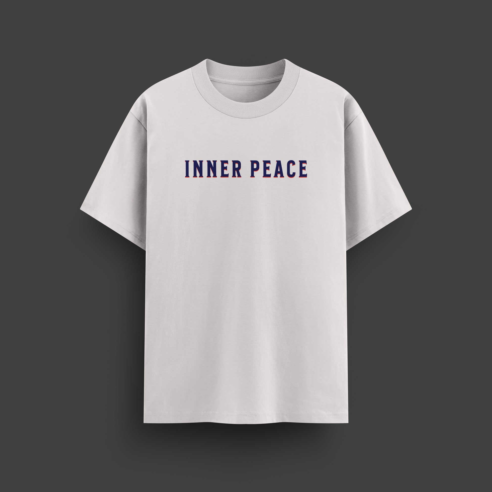 White t-shirt with 'INNER PEACE' text on a dark gray background