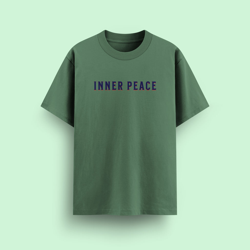 Green t-shirt with 'INNER PEACE' text on a light green background