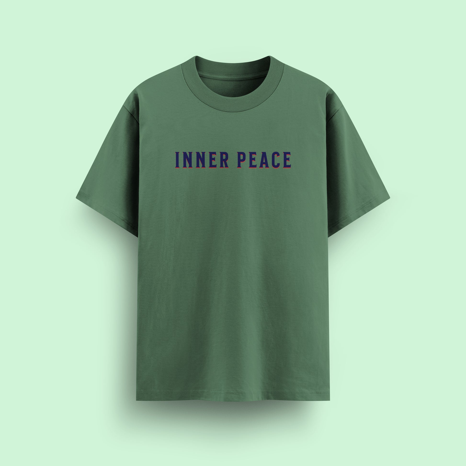 Green t-shirt with 'INNER PEACE' text on a light green background