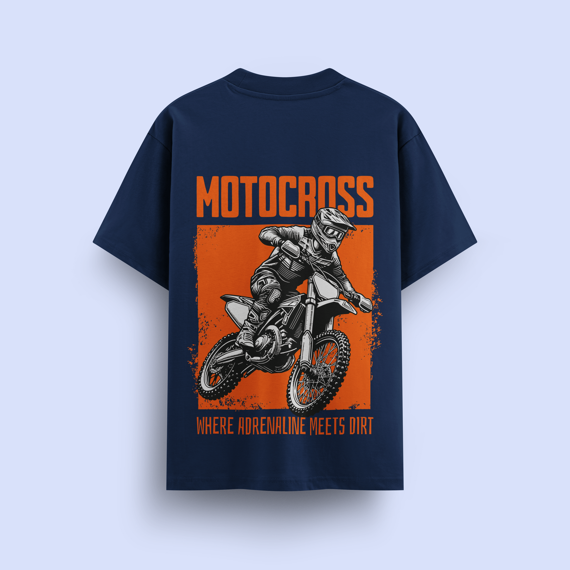 Navy blue t-shirt with motocross graphic and text on a light purple background