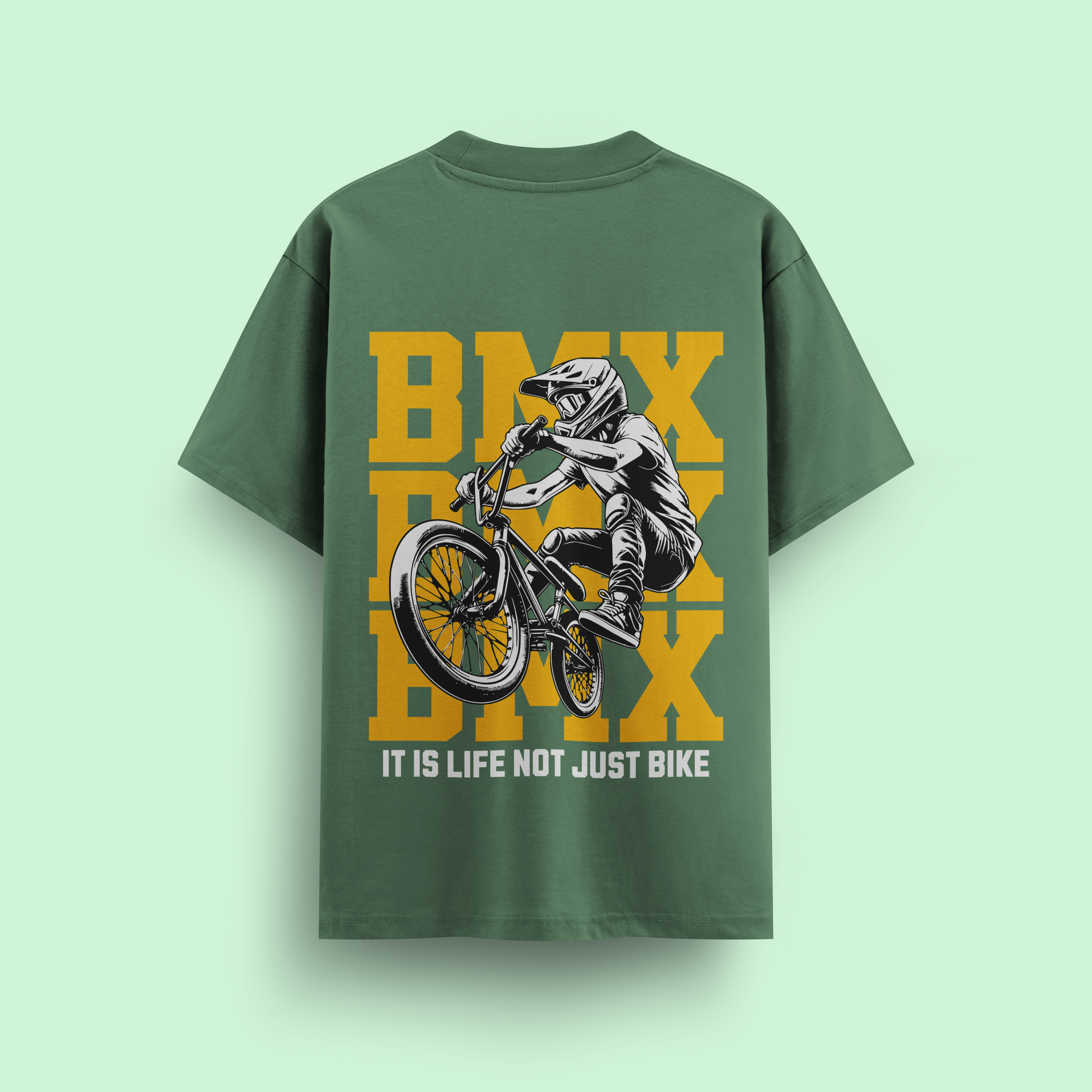 Green t-shirt with BMX graphic and text on a light green background
