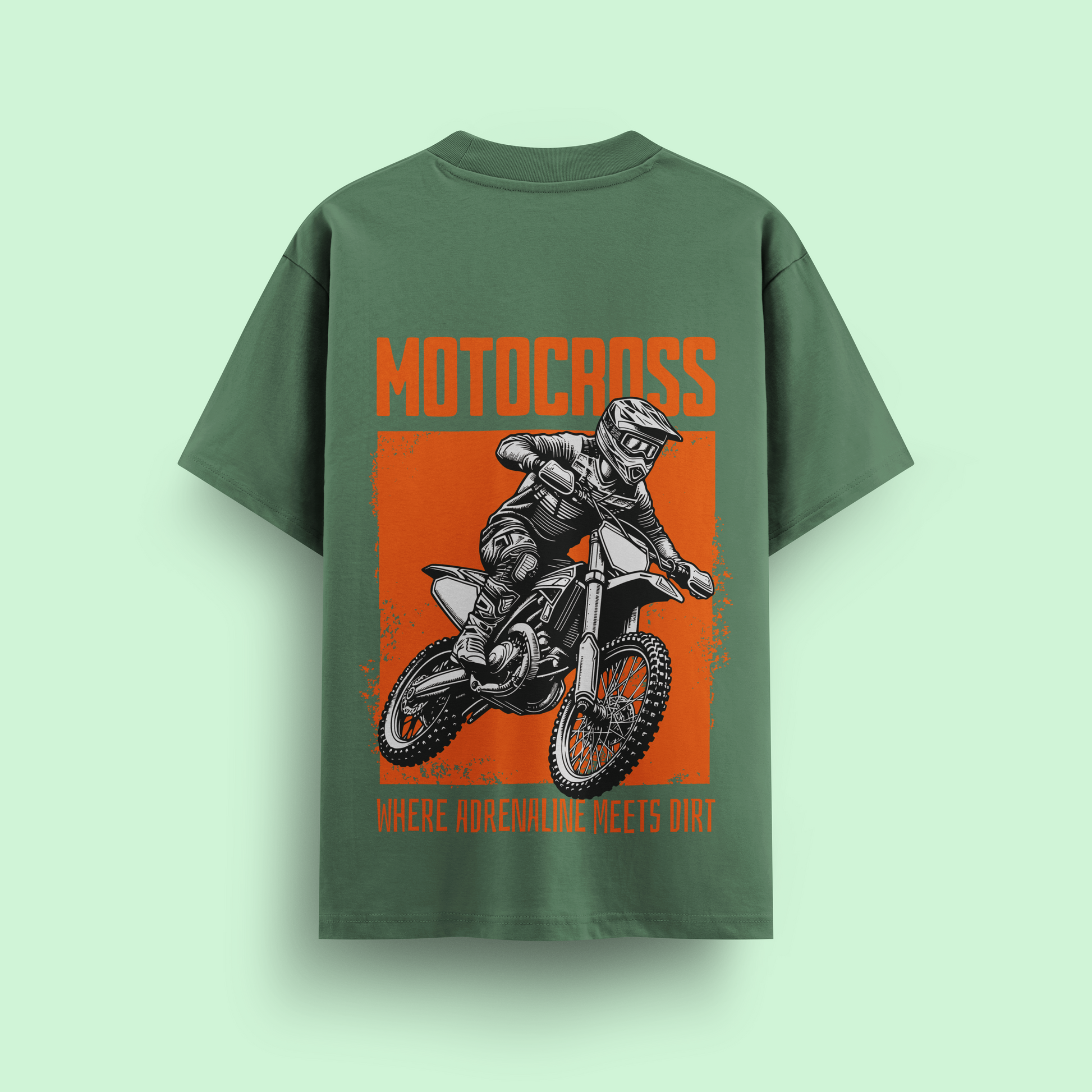Green t-shirt with motocross graphic and text on a light green background