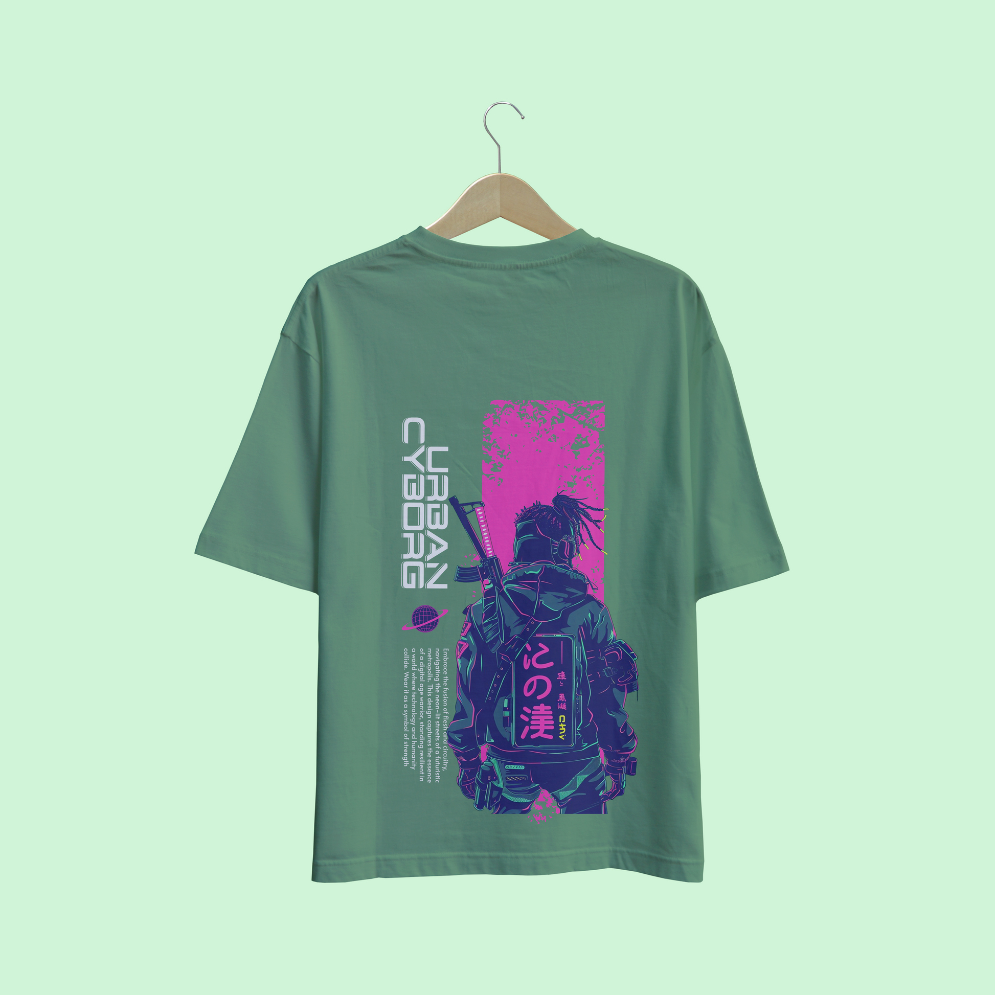 Green oversize t-shirt with a graphic design on a hanger against a light green background