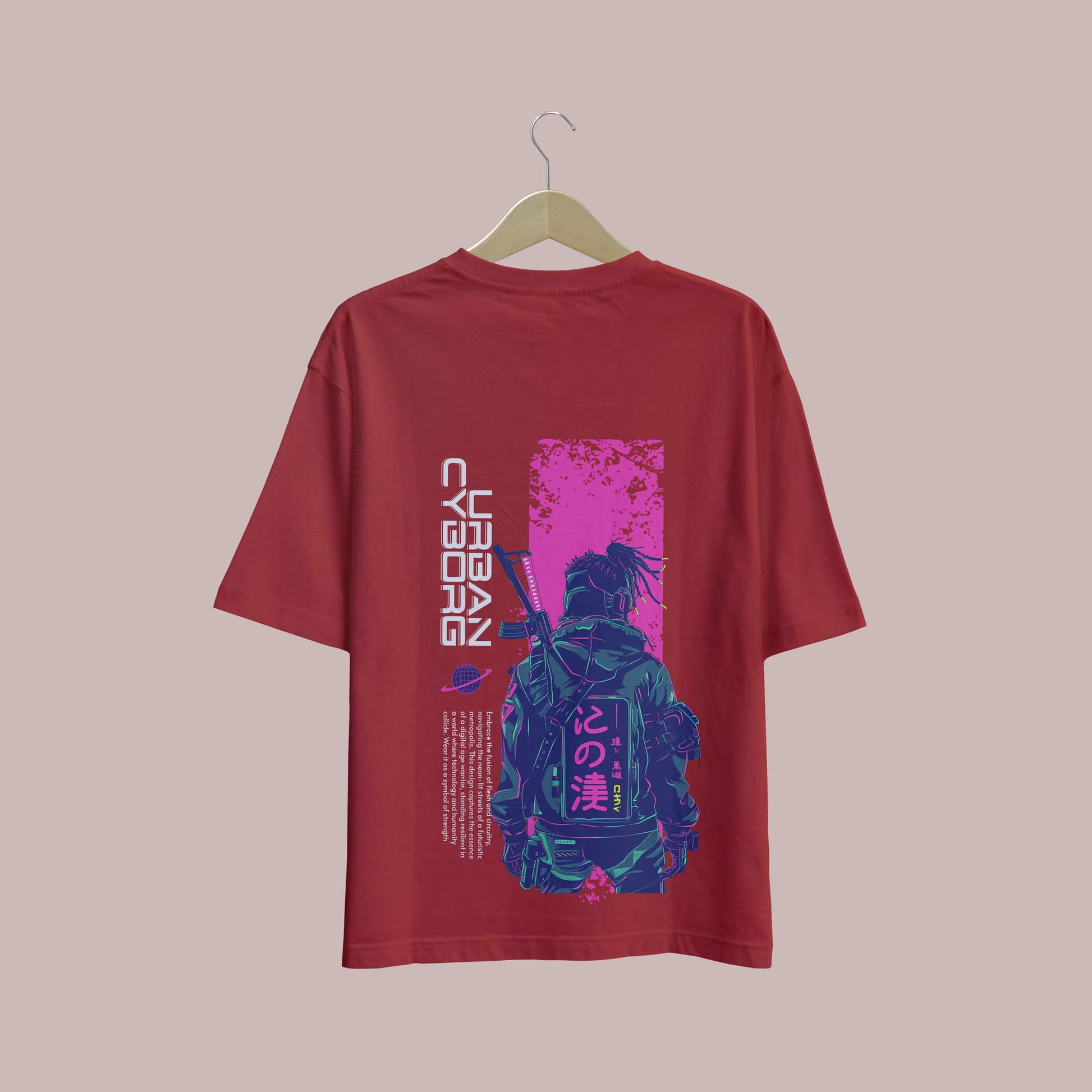 Red oversize t-shirt with a graphic design on a hanger against a plain background