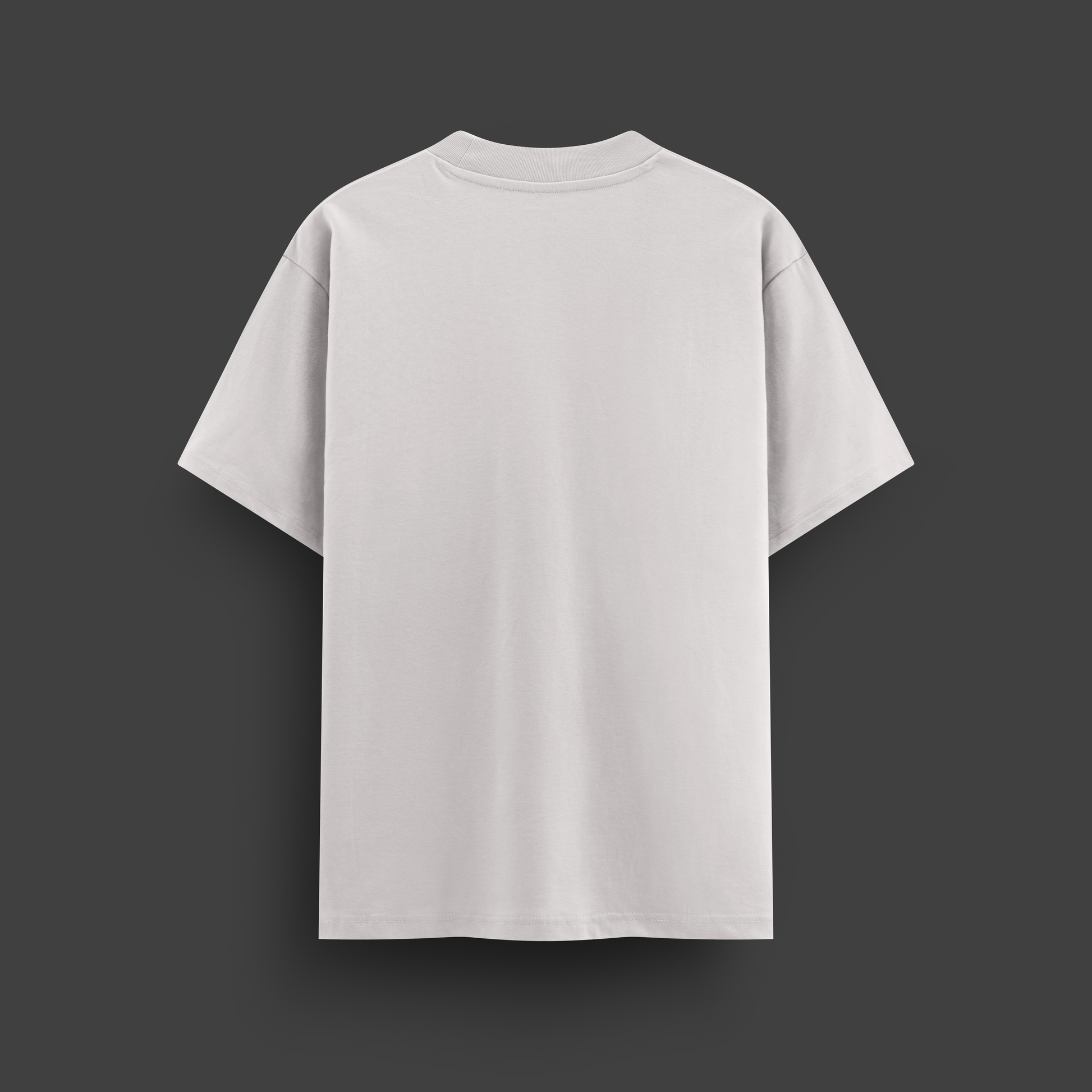 Plain white oversize t-shirt on a dark gray background