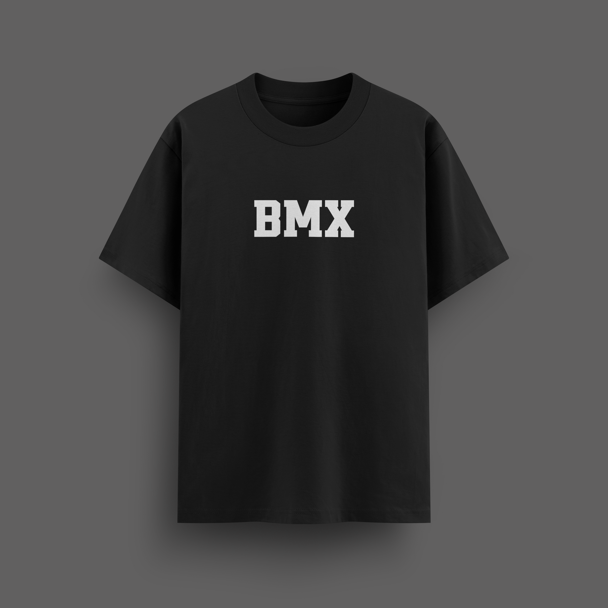 Black t-shirt with 'BMX' printed on it against a dark background