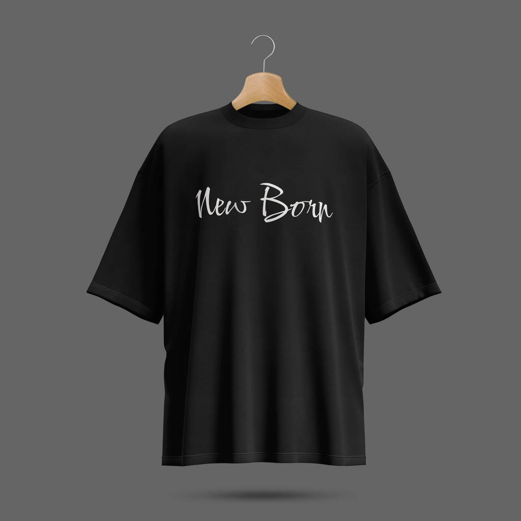 Black oversize t-shirt with 'New Born' text on a hanger against a dark background