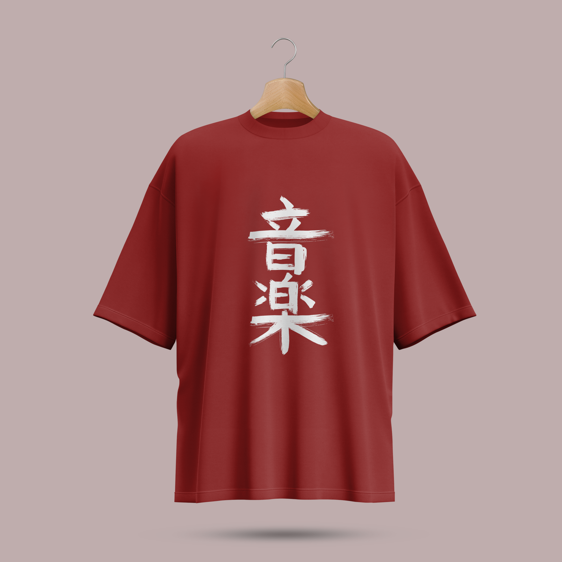 Red oversize t-shirt with white Chinese characters on a hanger against a beige background