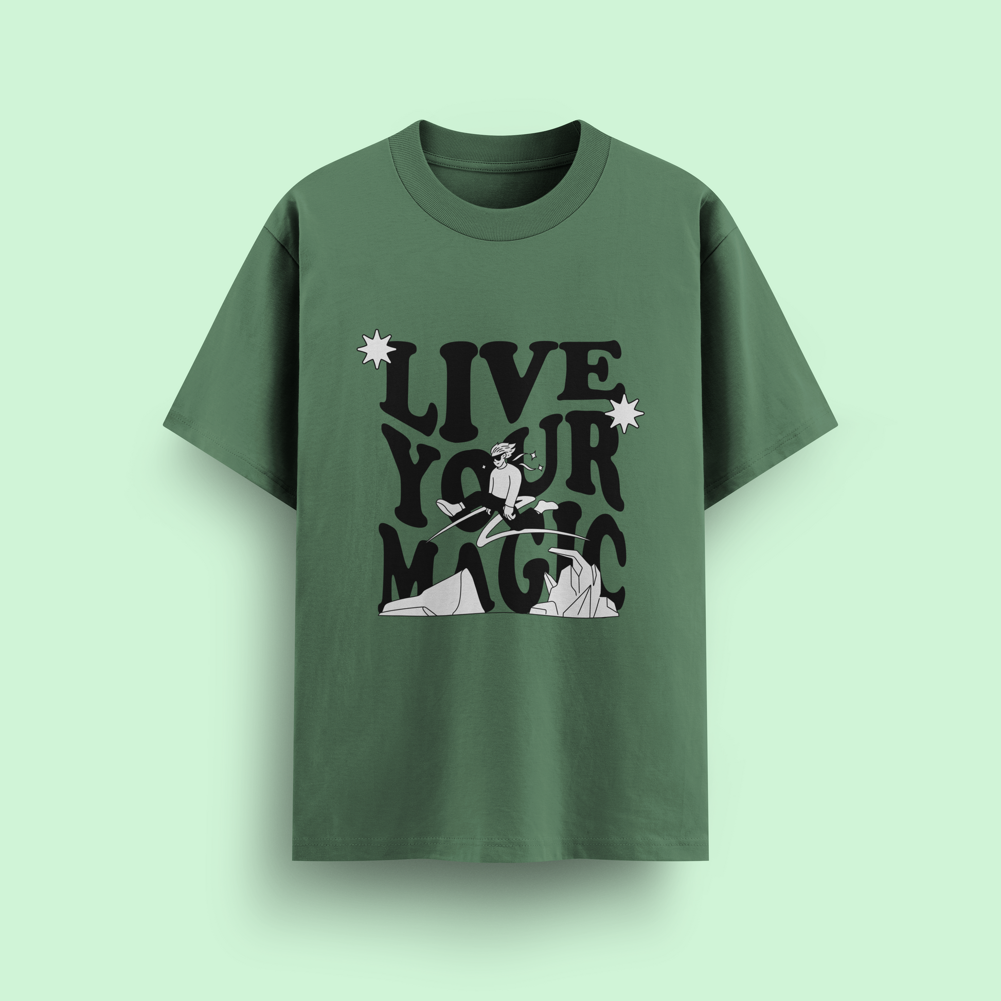 Green t-shirt with 'Live Your Magic' text and graphic on a light green background