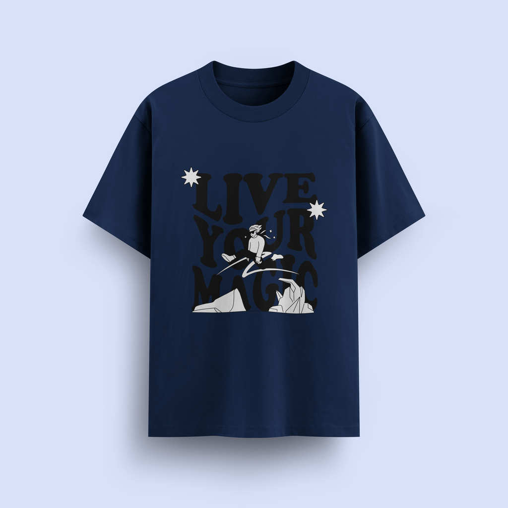 Navy blue t-shirt with graphic design and 'Live Your Magic' text on a light purple background