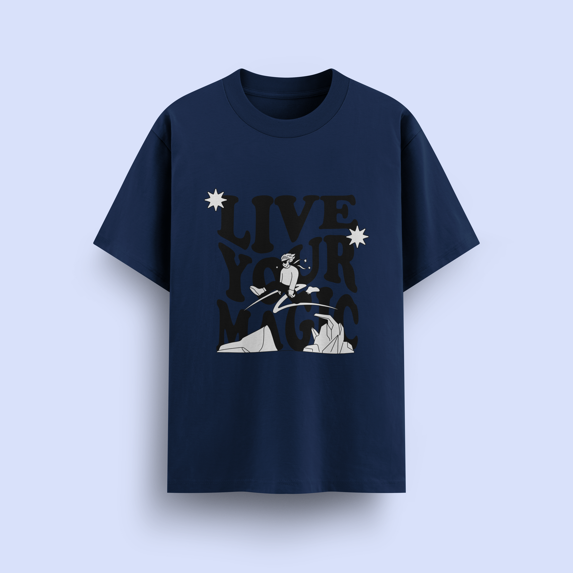 Navy blue t-shirt with graphic design and 'Live Your Magic' text on a light purple background
