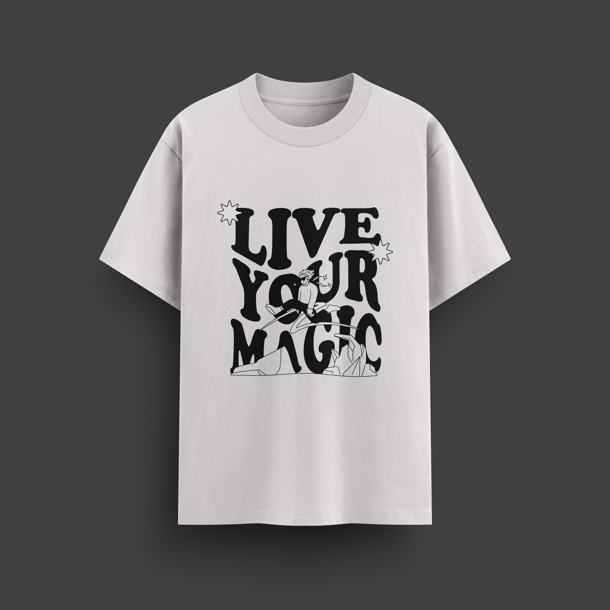 White t-shirt with 'Live Your Magic' text on a dark gray background